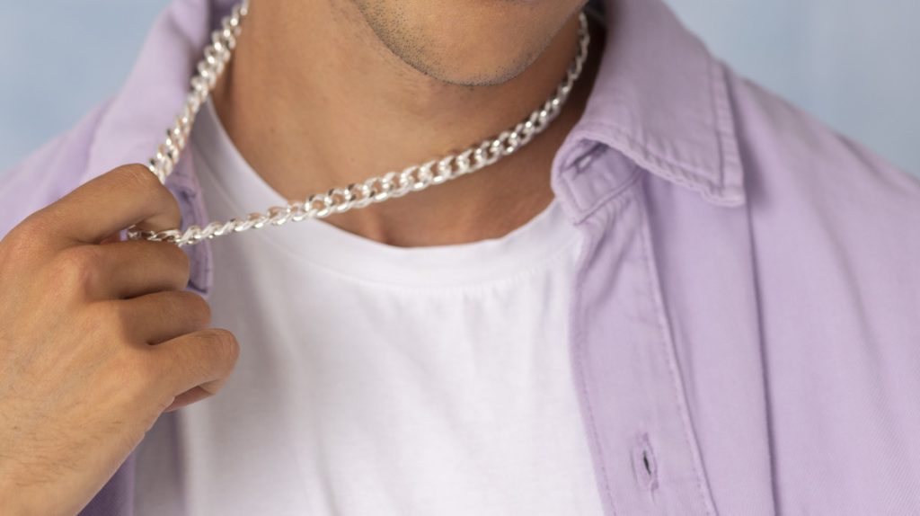 a Guy Wears a Necklace
